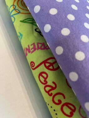 100% COTTON FABRIC: POLKA DOTS IN LAVENDER, ''PEACE N LOVE'' GREEN BACKGROUND